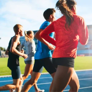 Athletes running during training to illustrate endurance and recovery supported by NAD⁺ IV therapy
