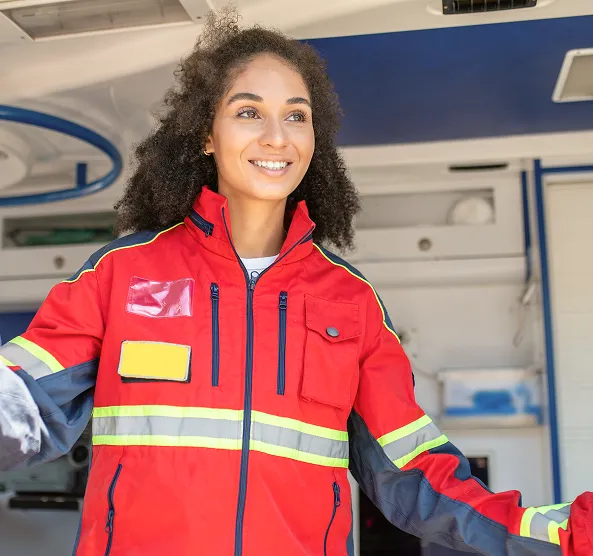Smiling first responder in ambulance representing Vitality Infusions discount for healthcare workers, military, and first responders
