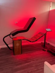 Medical-grade Dahlia red light therapy bed with full-body LED treatment panels for metabolism support, collagen production, and pain relief
