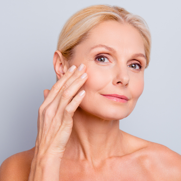Woman with healthy, radiant skin representing the benefits of anti-aging IV infusion therapy.